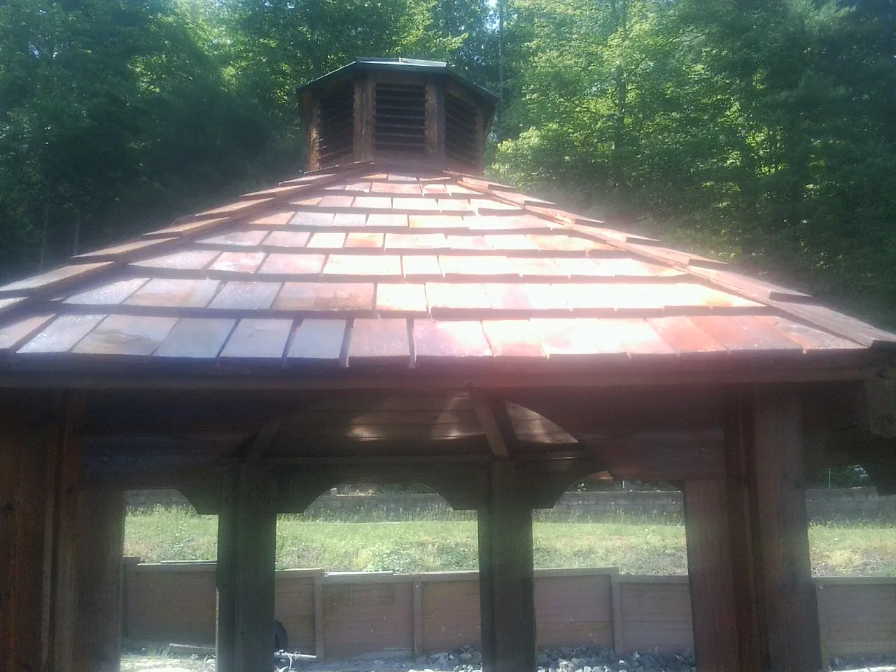 New cedar shake roof and cupola on a lakeside gazebo in Burkburnett